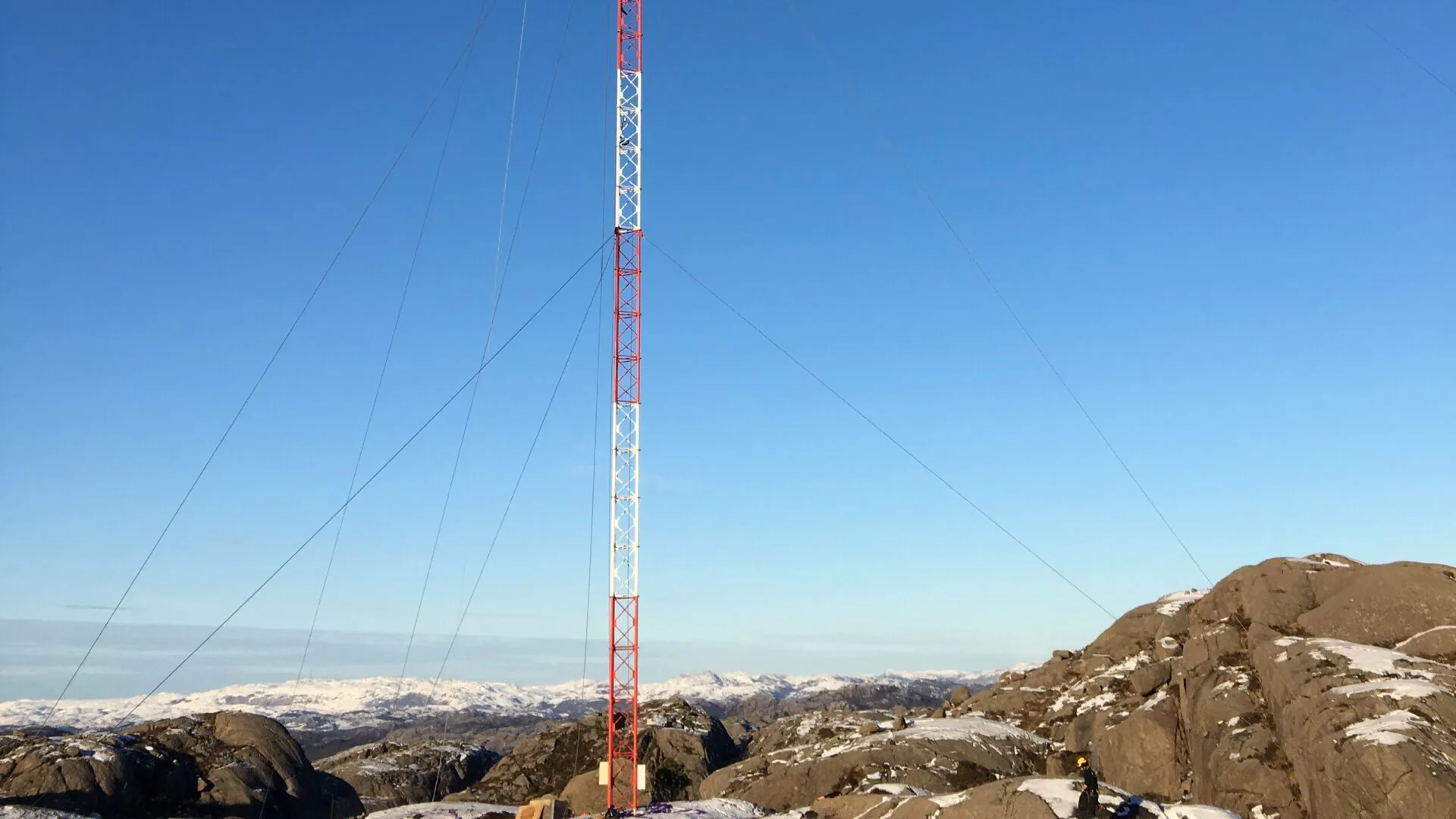 Guyed lattice met mast on an exposed mountain ridge