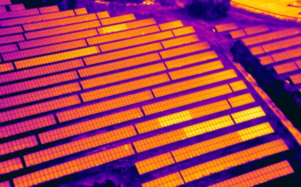 Aerial thermal image of a solar PV plant showing module temperature variation